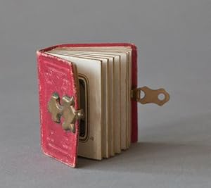 Miniature photograph album containing 13 images