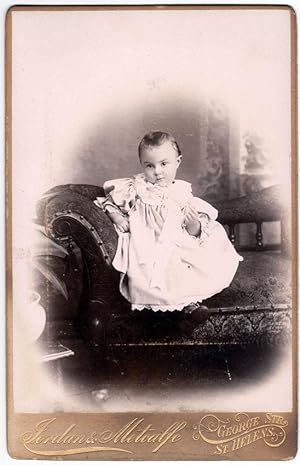 Cabinet St.Helens UK Portrait of a child on the sofa Photo Metcalfe 1890c S640