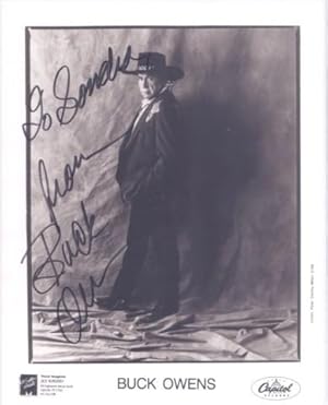 Imagen del vendedor de PROFESSIONAL, SIGNED PHOTOGRAPH OF BUCK OWENS:; in elaborate western suit, hat and boots a la venta por R & A Petrilla, IOBA