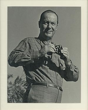 Bild des Verkufers fr Portrait Photograph of Ross Macdonald holding binoculars zum Verkauf von Between the Covers-Rare Books, Inc. ABAA