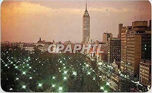 Seller image for Carte Postale Moderne Twilight over Mexico City. The Alameda is to the front the Latin American Tower to the back MEXICO for sale by CPAPHIL