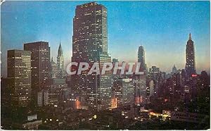Seller image for Carte Postale Moderne Night Falls on Midtown Manhattan Showing RCA Building Chrysler Building and Empire State Building for sale by CPAPHIL