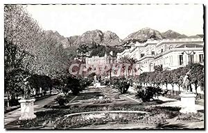 Bild des Verkufers fr Carte Postale Ancienne Menton Les Jardins Au fond Le Palais Lutetia zum Verkauf von CPAPHIL