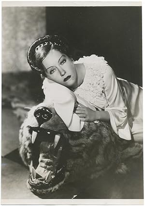 Bild des Verkufers fr [Press photograph]: Gloria Swanson reclining on a Tiger Skin Rug zum Verkauf von Between the Covers-Rare Books, Inc. ABAA