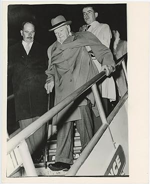 An original press photo of Sir Winston S. Churchill on 29 September 1960 being helped to disembar...