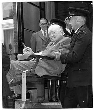 An original press photo of Sir Winston S. Churchill being carried out of Middlesex Hospital on 21...