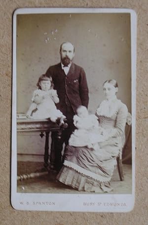 Carte De Visite Photograph. A Studio Portrait of a Husband & Wife with their Young Children.