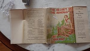 Seller image for THE SECRET OF SUNDIAL IN COLOR DUSTJACKET by J. Francis Rigney, of Girl seated on Fence wearing Red Handkerchief & Boots in Forest by Lake, MADGE STERLING SERIES, for sale by Bluff Park Rare Books