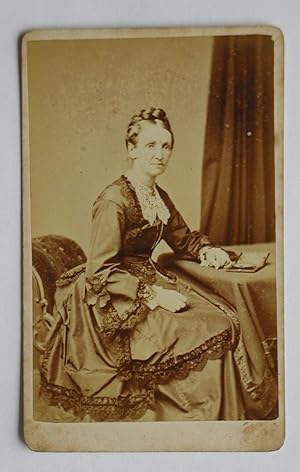 Carte De Visite Photograph: A Studio Portrait of a Finely Dressed Lady.