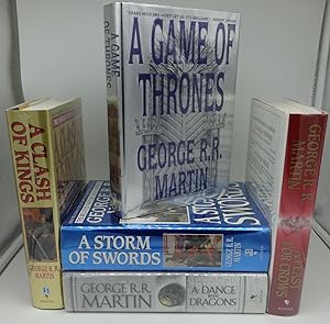 Seller image for A GAME OF THRONE (Five Volumes Complete) (Vol. One SIGNED/INSCRIBED) Vol. Two A CLASH OF KINGS (SIGNED); Vol. Three A FEAST OF CROWS (SIGNED) for sale by Booklegger's Fine Books ABAA