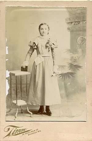 Photograph of a Girl Holding a Hymnal