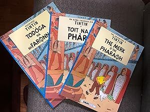 Imagen del vendedor de Unique Set of 3 books from The Adventures of TINTIN - The Cigars of the Pharaoh in 3 different languages published by DALEN - Eachtrai Tintin Todoga Na Bh Faronna (Irish Ghaeilge), Toit Nam Pharo (Scots Gaidhlig) and The Merk O The Pharaoh (Scot) a la venta por CKR Inc.