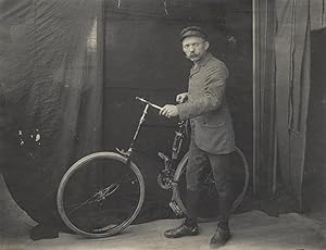 Photographic print of a man with a bicycle