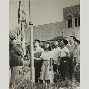 Japanese Students Under Fire [Press Photograph of Japanese American Students Raising a US Flag]