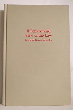 Imagen del vendedor de A BACKHANDED VIEW OF THE LAW Irreverent Essays on Justice a la venta por Sage Rare & Collectible Books, IOBA