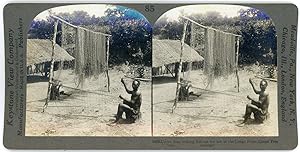 Stereo, Keystone View Company, Underwood & Underwood, Upoto man making fish net for use in Congo ...