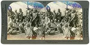 Stereo, Keystone View Company, Underwood & Underwood, A Kikuyu warrior buying a wife from her fat...