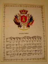 Escudo de Gibraltar y partitura musical de una overtura