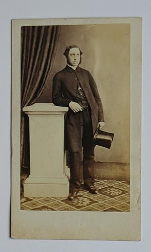 Carte De Visite Photograph: Studio Portrait of a Gentleman with a Top Hat.