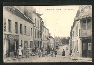 Carte postale Guignes-Rabutin, Rue de Paris, vue de la rue