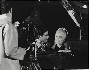 Bild des Verkufers fr The Umbrellas of Cherbourg [Les Parapluies de Cherbourg] (Original photograph of Catherine Deneuve and Nino Castelnuovo on the set of the 1964 French film) zum Verkauf von Royal Books, Inc., ABAA