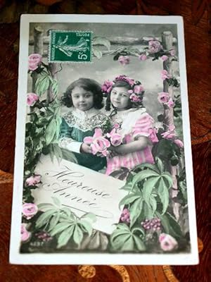 Image du vendeur pour Carte Postale Ancienne - FANTAISIE. HEUREUSE ANNEE. Couple d'enfants. Carte colorise. mis en vente par JOIE DE LIRE