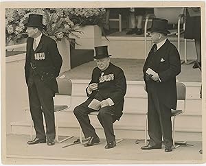 PREMIERS AT THE SALUTING BASE - An original press photograph capturing British Prime Minister Cle...