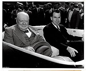 An original press photograph of Prime Minister Sir Winston Churchill on 25 June 1954 being greete...