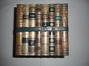 Seller image for A Tin Bicuit Box Shaped As Eight Classic Novels Tied With A Strap This ' Library ' = Gulliver's Travels; Burns; Robinson Crusoe; Pickwick Papers; Self-Help; Shakespeare; Pilgrims Progress and the History of England. for sale by Sue Lloyd-Davies Books