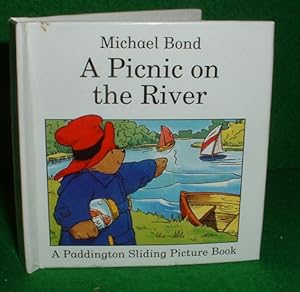 Image du vendeur pour A PICNIC ON THE RIVER A Paddington Small Sliding Picture Book mis en vente par booksonlinebrighton