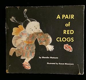 A PAIR OF RED CLOGS