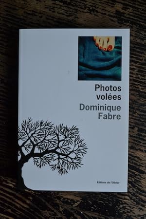 Bild des Verkufers fr Photos voles zum Verkauf von Un livre en poche