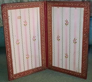 Large leather folder with gilt decoration and silk lining.