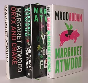 Seller image for Oryx and Crake [with] The Year of the Flood [with] Maddaddam. [First UK Editions.] THE MADDADDAM TRILOGY IN UNCLIPPED DUSTWRAPPERS; FINAL VOLUME SIGNED BY THE AUTHOR for sale by Island Books