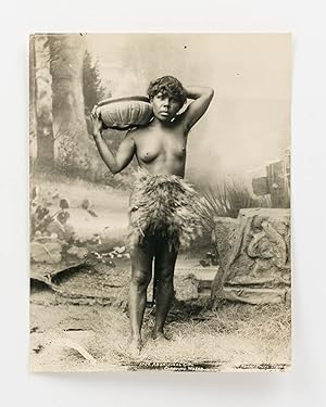 'Aboriginal Girl Carrying Water' [a studio tableau portrait photograph of an Indigenous woman wea...