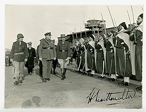 An original Second World War photograph of British General Henry Maitland Wilson inspecting Frenc...