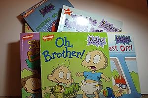Bild des Verkufers fr Rugrats, 8 Books: Reptar to the Rescue; ; Sight for Sore Eyes, Thank You Angelica; Catches a Cold; Reptar's Surprise Visit; Stormy Weather; Pizza Cats; Camp Out; Major-Leagure Dads zum Verkauf von Hammonds Antiques & Books