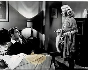 Immagine del venditore per A VINTAGE CONTINUITY LAYOUT PHOTOGRAPH depicting GINGER ROGERS speaking with JEAN-PIERRE AUMONT as he's reclining on his hotel bed in a scene from "HEARTBEAT". venduto da Blue Mountain Books & Manuscripts, Ltd.