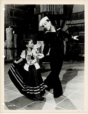 Seller image for A VINTAGE PUBLICITY PHOTOGRAPH of Hollywood Movie Star & Dancer GENE KELLY dancing with 7 year old child actress SHARON McMANUS in a scene from ANCHORS AWEIGH. for sale by Blue Mountain Books & Manuscripts, Ltd.