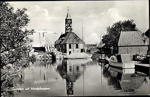 Seller image for Ansichtskarte / Postkarte Hindeloopen Hylpen Hindeloope Friesland Niederlande, Wasserpartie, Kirche, Haus, Boot for sale by akpool GmbH