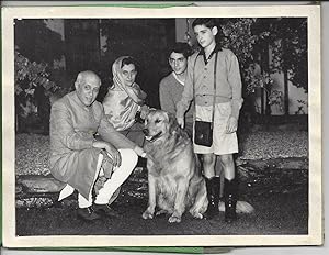 Bild des Verkufers fr [Pandit Nehru, Indira (Nehru) Gandhi and her Sons] Family Photograph of Pandit Nehru, Indira Gandhi and her two sons, Rajiv and Sanjay. With, on reverse, a signed greetings from Indira Gandhi. zum Verkauf von Richard M. Ford Ltd