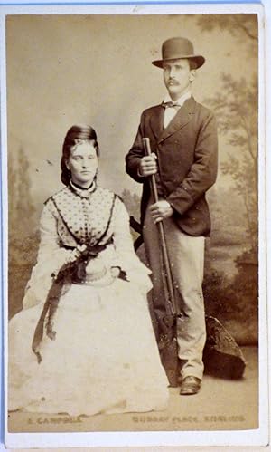 Carte de Visite - DOUBLE PHOTOGRAPH PORTRAIT OF SEATED LADY AND STANDING MAN HOLDING GUN