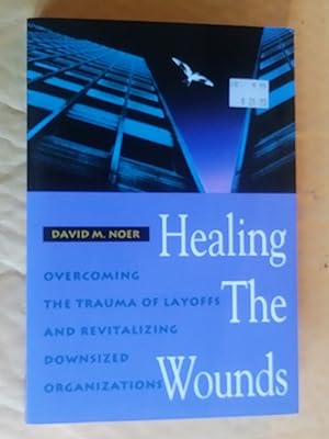 Imagen del vendedor de Healing the Wounds: Overcoming the Trauma of Layoffs and Revitalizing Downsized Organizations (Jossey Bass Business & Management Series) a la venta por Livresse