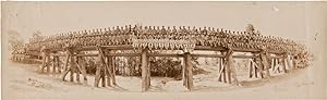 [PANORAMIC PHOTOGRAPH OF THE 1321st ENGINEER GENERAL SERVICE REGIMENT, COMPANY F, SITTING ON A ...