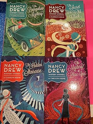 Bild des Verkufers fr Nancy Drew Mystery stories (1-4 The Hidden Staircase-The Bungalow Mystery-The Mystery at Lilac Inn-The Secret of the Old Clock) in slipcase zum Verkauf von Happy Heroes