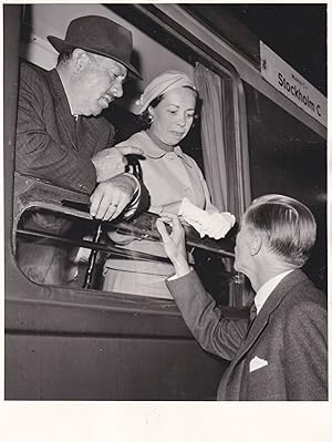 Original photograph of John Steinbeck and his wife Elaine on a train in Stockholm, circa 1957