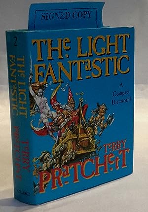The Light Fantastic. A COMPACT DISCWORLD. PRESENTATION COPY FROM THE AUTHOR.