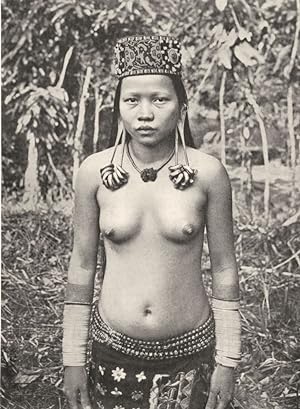 A Lirong woman with distended Ear-lobes - The lobe of the ear of Kayan and Kenyah women is pierce...