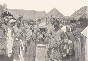 Image du vendeur pour Sehgura players, Sierra Leone - The Sehgura is a small hollow gourd covered loosely by a netting of country-grown cotton, upon which are strung split hard shells of seeds. The long end of the netting is held in the left hand and the short neck of the gourd in the right. The sound is caused by the hard seeds striking the gourd, and can be modulated at will by the netting being relaxed or tightened mis en vente par Antiqua Print Gallery