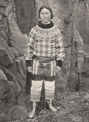 Seller image for A Greenland Beauty - In and near the settlements there are some quite attractive-looking women, but these are not the pure Eskimo breed. The faces and features of the pure-bred Eskimos are flatter than that which is shown. The lace adornment is uncommon, and is probably foreign work. The girl shown is about twenty years old, and is Mongolian with a mixture of Danish blood. She comes from Tkerasak, North-west Greenland for sale by Antiqua Print Gallery